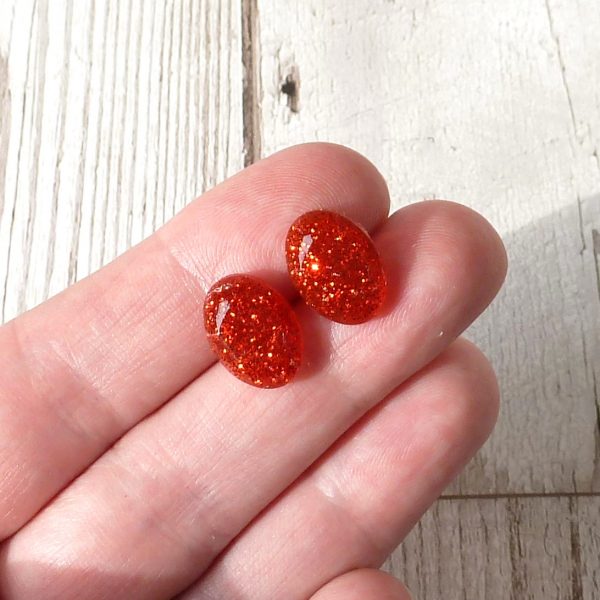 Red Oval Glitter Studs on hand