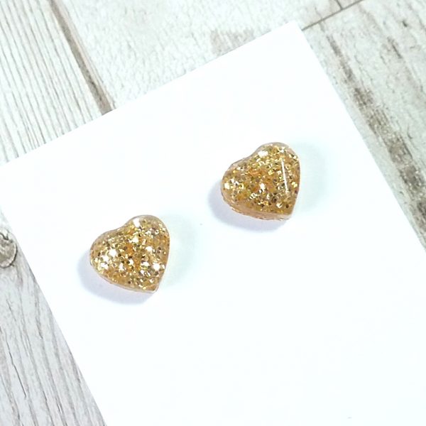 Gold heart studs on card