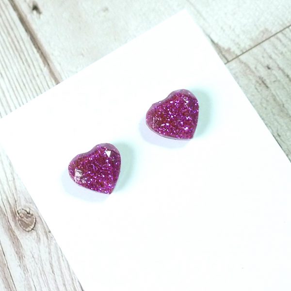 Purple glitter heart studs on card