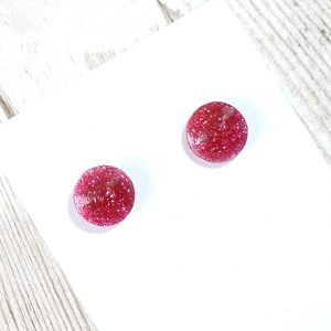 Hot pink round studs on card