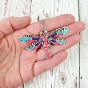 Pink purple turquoise dragonfly pendant on hand