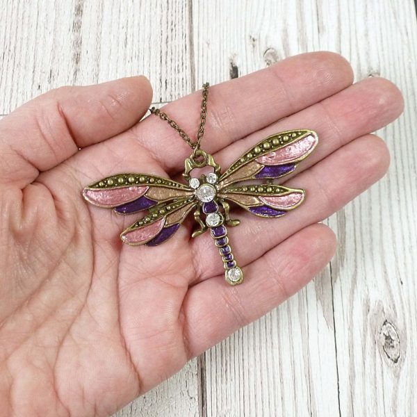 Rose Gold and Purple Dragonfly pendant on hand
