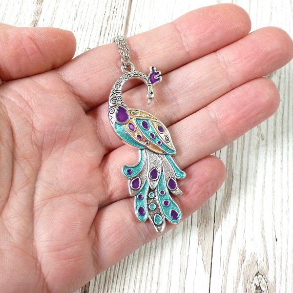 turquoise purple gold peacock on silver on hand