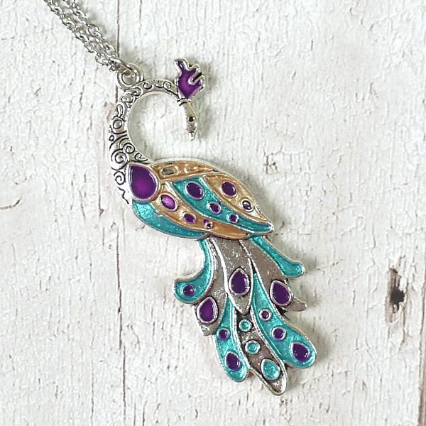turquoise purple gold peacock on silver on wood view 1