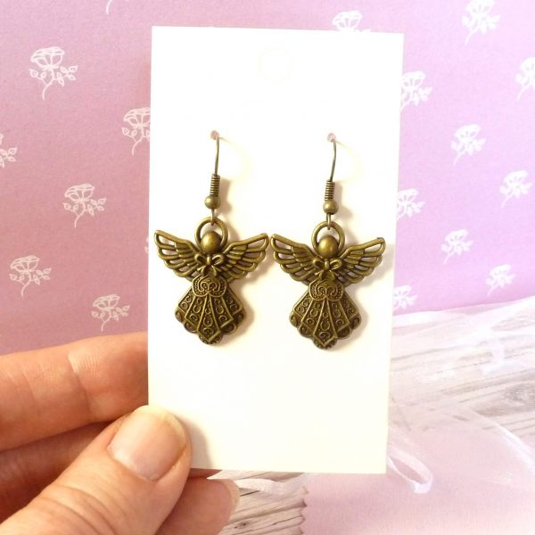 bronze angel earrings on card