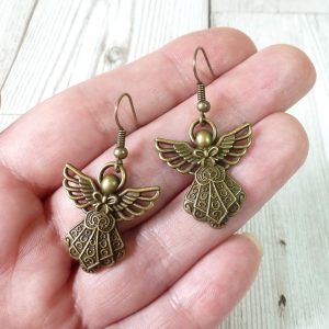 bronze angel earrings on hand
