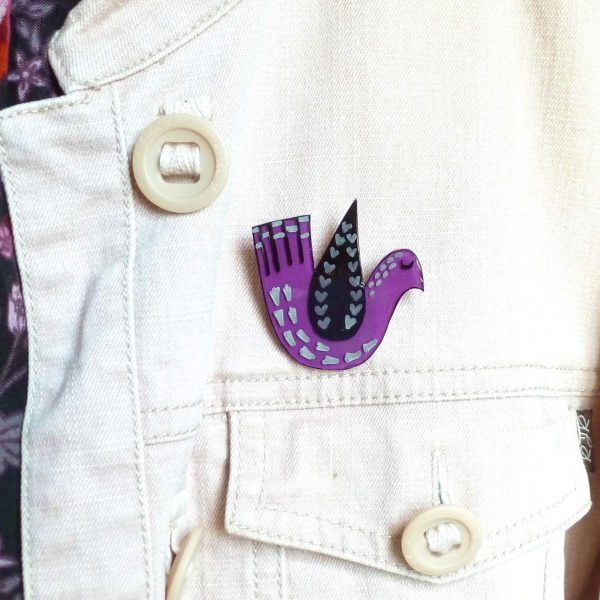 Purple love bird brooch on jacket