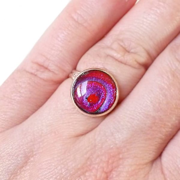 Purple Red Swirls ring on hand