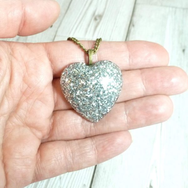 Silver Glitter large heart pendant on hand