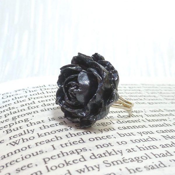 Graphite Silver Rose Ring on book