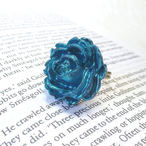 Turquoise Rose Ring on book