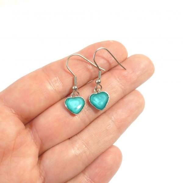 Turquoise Steel Heart Dangle Earrings on hand