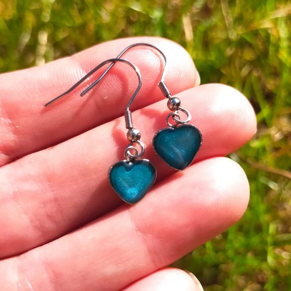 Turquoise steel heart Dangle Earrings on hand 1
