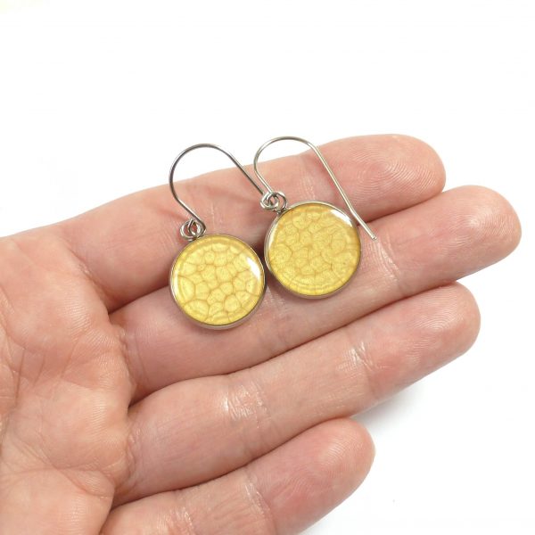 Golden Yellow 18mm steel earrings on hand
