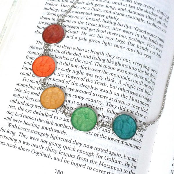Rainbow Necklace on book