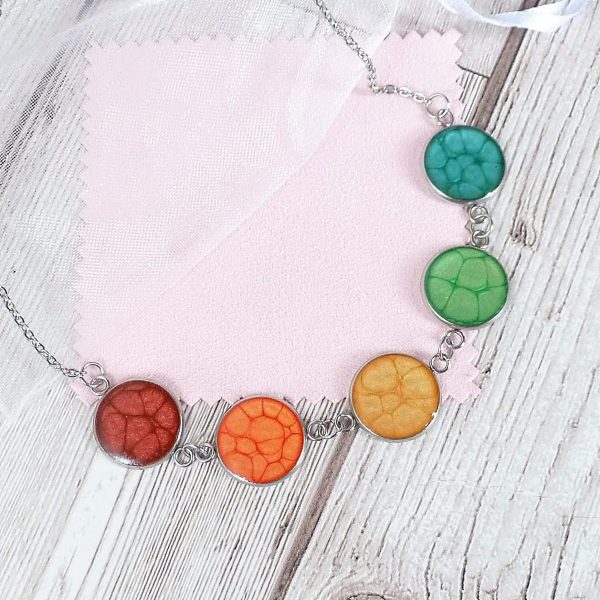 medium 5 bezel rainbow necklace on pink and wood 2