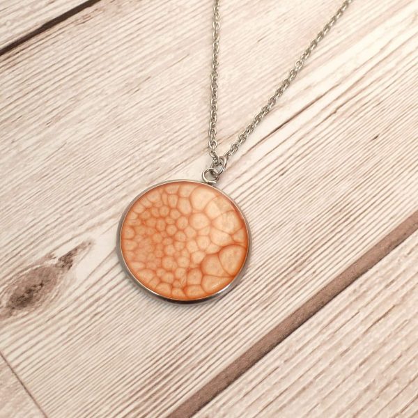 peach pink 25mm Pendant on wooden background