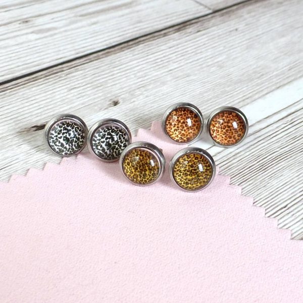 10mm gold bronze silver studs on wooden background
