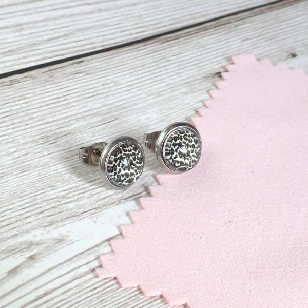 10mm silver studs on wooden background