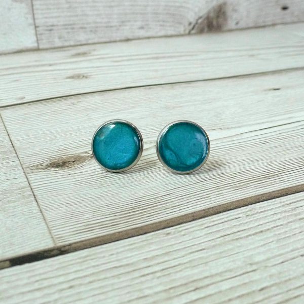 14mm Turquoise blue steel studs on wooden background