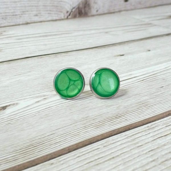 14mm green steel studs on wooden background