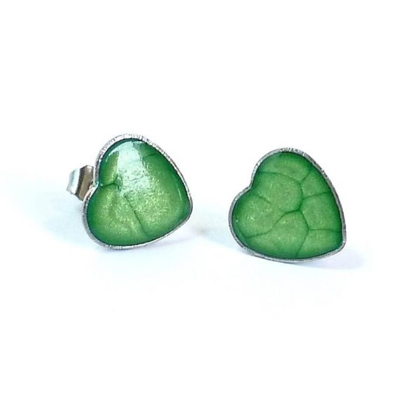 Green heart studs on white