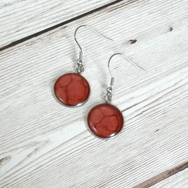 Red 18mm dangle on wooden background