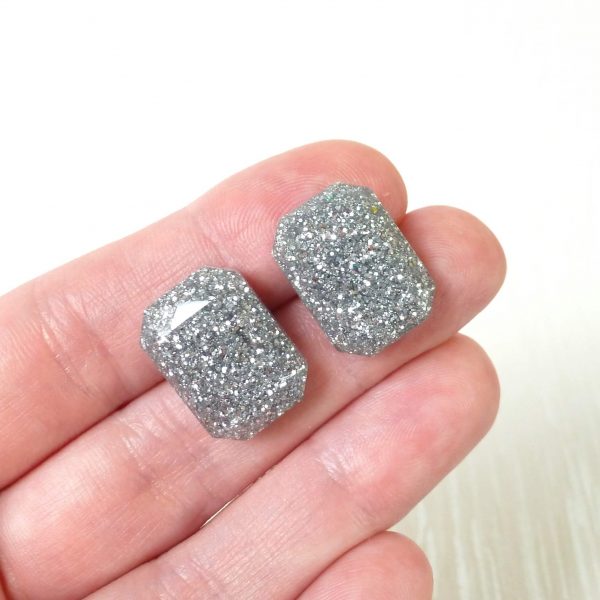 Silver large octagon studs on hand