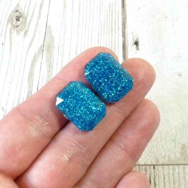 Turquoise Glitter large octagon studs on hand