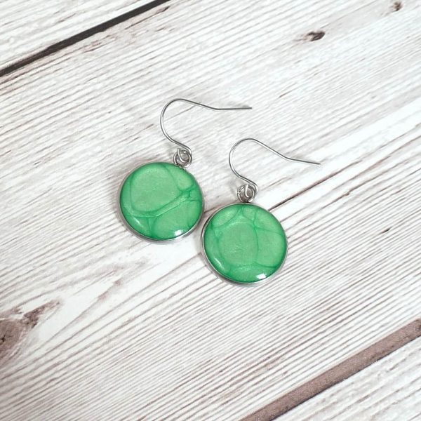 green 18mm dangle on wooden background