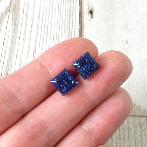 tiny blue square studs on hand