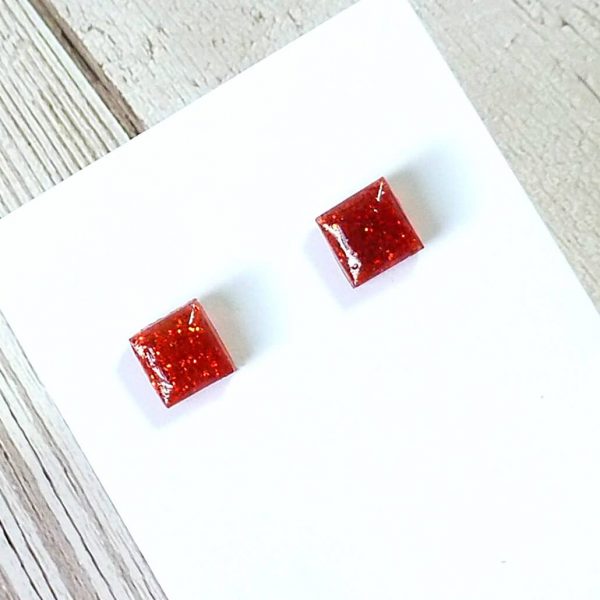tiny red square studs on card