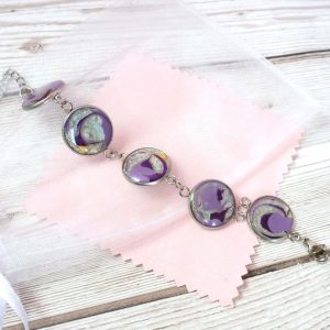 Purple and silver swirls bracelet on pink view 2