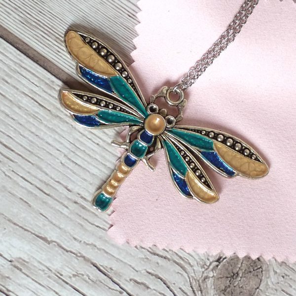 blue teal and gold dragonfly on pink view 2