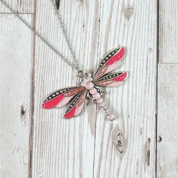 pink pink rose dragonfly on wooden background
