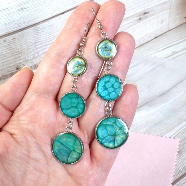 Blue turquoise 3 drop earrings on hand