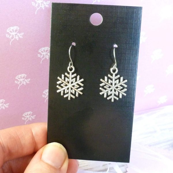 snowflake earrings on card