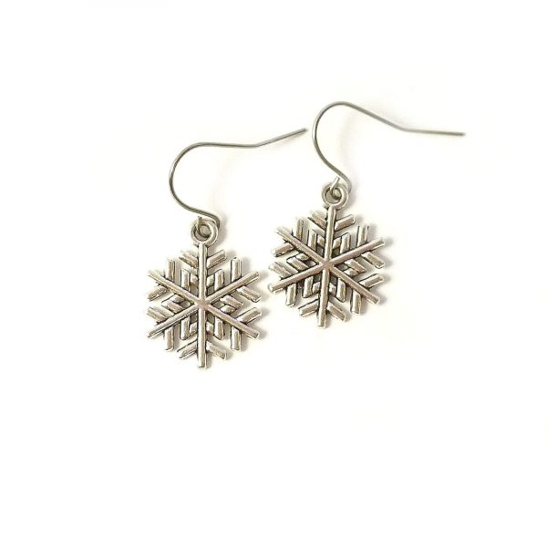 snowflake earrings on white background