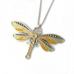 Lime green and gold dragonfly pendant on white background